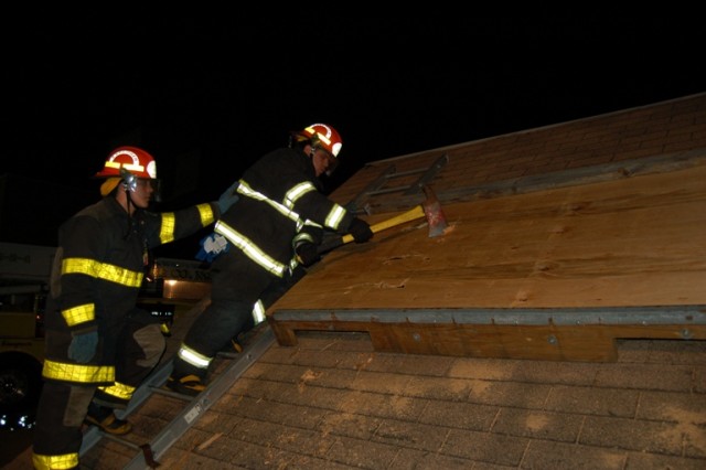 Mike Ortiz and Bill Mott work on the roof prop.